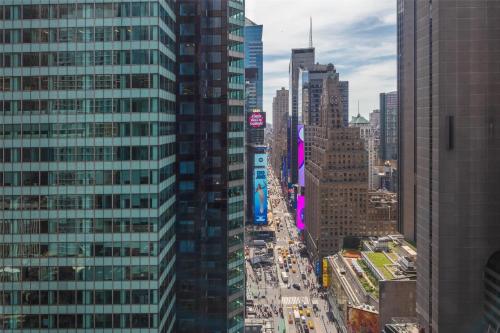 an aerial view of a city with tall buildings at Tempo By Hilton New York Times Square in New York