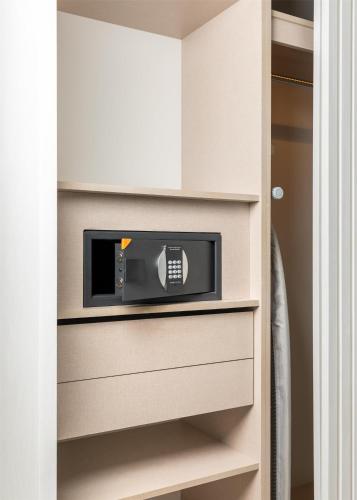 a built in microwave in a closet at Hilton Skanes Monastir Beach Resort in Monastir