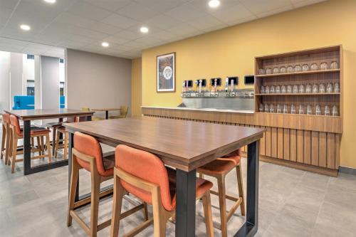 a dining room with two tables and chairs at Hampton Inn & Suites by Hilton Little Rock Airport in Little Rock