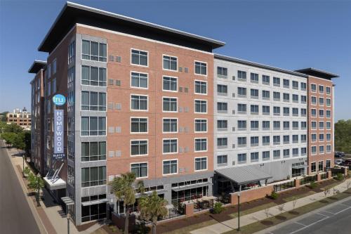 a large brick building on a city street at Homewood Suites By Hilton Columbia Downtown in Columbia
