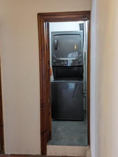 a television is sitting on top of a refrigerator at Casa del Rey in Taxco de Alarcón