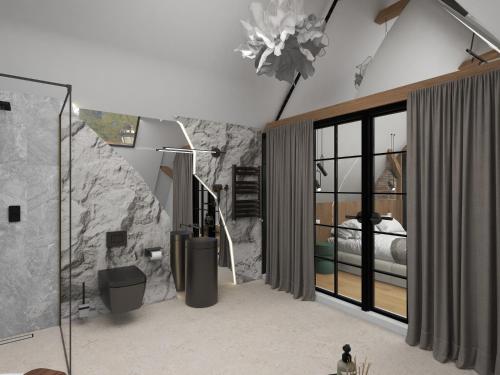 a bedroom with a large stone wall and a bed at Sennse Boutique Hotel in Sibiu