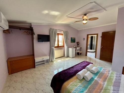 a bedroom with a bed with two pillows on it at B&B Buena Vista in Fiumicino