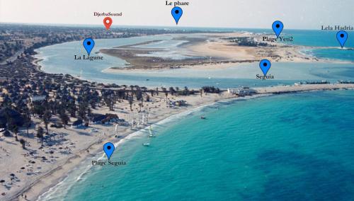 an aerial view of a beach with a map at Villa Petra DjerbaSound in Midoun