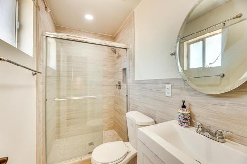 a bathroom with a shower and a toilet and a sink at 3 Mi to Dtwn Mesa Home with Fenced Backyard! in Mesa