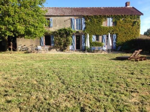 a house with a lawn in front of it at La Brionniere in Aizenay