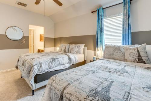 a bedroom with two beds and a window at Pet-Friendly Home with Patio and Yard in Rosharon in Rosharon
