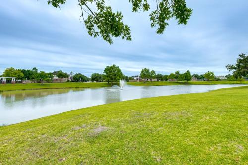 a pond with a fountain in the middle of a park at Pet-Friendly Home with Patio and Yard in Rosharon in Rosharon