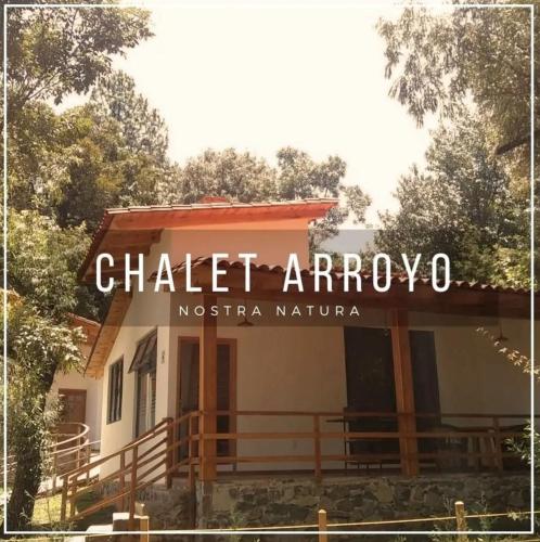 a building with a sign that reads charlet arroyo at Nostra Natura Chalets in Mazamitla