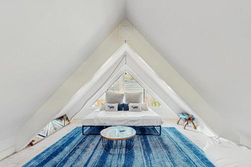 a room with a bed and a large window at The Wild Pine Lodge in Incline Village