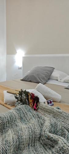 a bedroom with two beds with towels and a blanket at A Due Passi dal Mare in Catanzaro