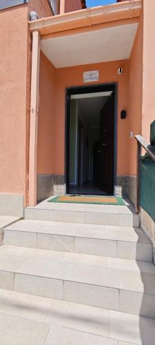 a set of stairs leading to a door of a building at A Due Passi dal Mare in Catanzaro
