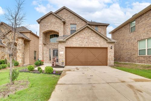 a brick house with a garage at Walk to Lake Ray Hubbard Spacious Family Home! in Forney