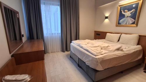 Кровать или кровати в номере Orange Garden Aparts & Hotel THE NORDIC