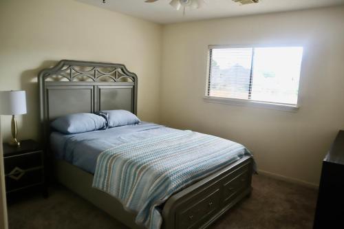 a bedroom with a bed and a window at Spring Haven Retreat access to trails and lakes in Spring