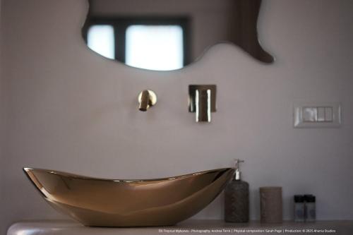 a bathroom with a bowl sink and a mirror at ELLI TROPiCAL LUXURY SUITES SUNSET-INFINITY POOL- SEA SIDE-NEAR CENTER PARKING in Mikonos
