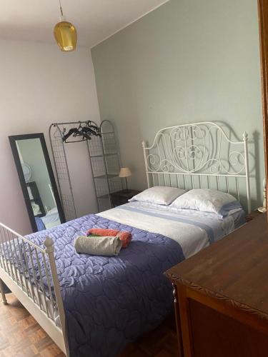 a bedroom with a white bed and a mirror at Lime Beach 2 in Armação de Pêra
