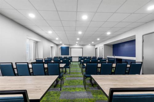 an empty conference room with tables and chairs at Spark by Hilton Wilkes Barre in Wilkes-Barre
