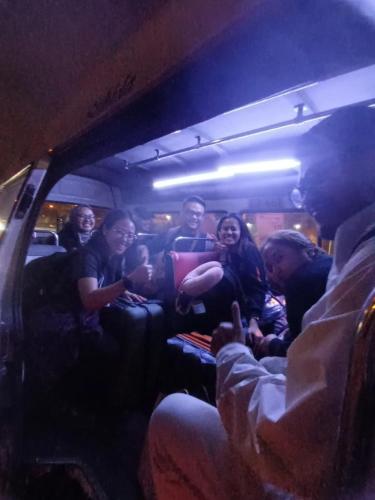 a group of people sitting in a bus at Hostel AyJ Familia Round Trip Airport Tr4nsfer Included in Lima