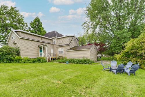 a house with chairs in the yard at 11 Mi to Oneida Lake Spacious Apt in Verona! in Verona