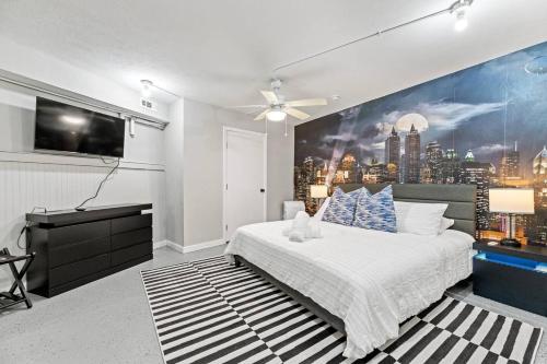 a bedroom with a large mural of a city at Dome Manor 2 Game Rooms, Hot Tub & Pool! in Bedford
