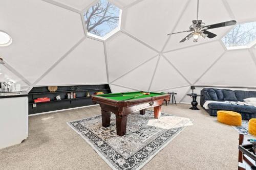 a living room with a pool table in a tent at Dome Manor 2 Game Rooms, Hot Tub & Pool! in Bedford