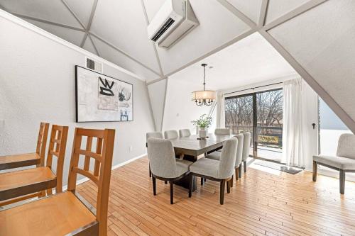 a dining room with a table and chairs at Dome Manor 2 Game Rooms, Hot Tub & Pool! in Bedford