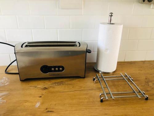 a toaster and a roll of paper towels on a counter at Bismarck 2 in Swakopmund