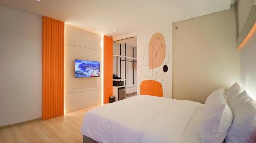 Postel nebo postele na pokoji v ubytování OS Style Hotel Batam Centre
