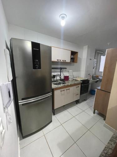 Una cocina o zona de cocina en Apto 2 qts em Xerém próximo ao CT do Fluminense