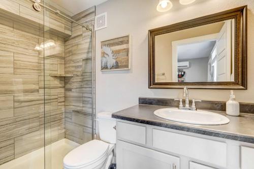 a bathroom with a toilet and a sink and a shower at Vermijo Nook Walk to OCC Downtown w Fire Pit in Colorado Springs