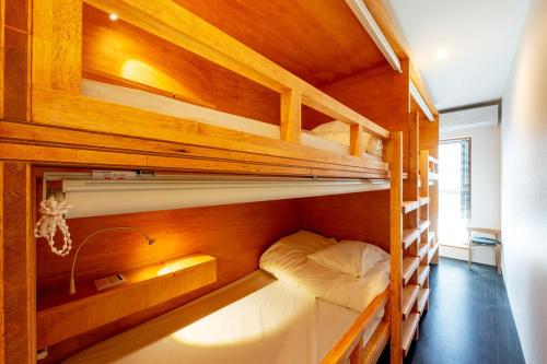 a bunk room with two bunk beds in it at The European House Pattaya in North Pattaya