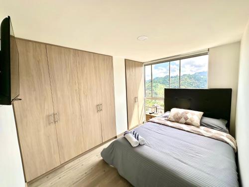 Ένα ή περισσότερα κρεβάτια σε δωμάτιο στο Lujoso apto central Urban