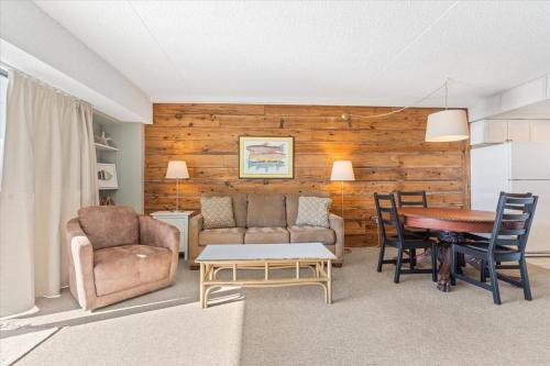 a living room with a couch and a table at Ocean View 3BR Condo with Pool in North Ocean City in Ocean City