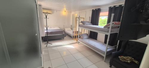 Postel nebo postele na pokoji v ubytování Hostel Pousada Curitiba Budget