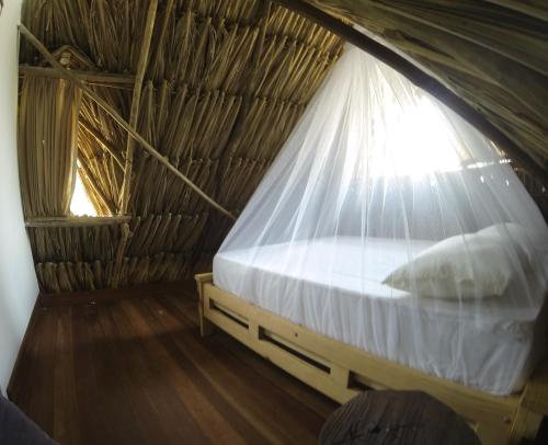 מיטה או מיטות בחדר ב-Sexto Sentido Cabañas & Pan Frances