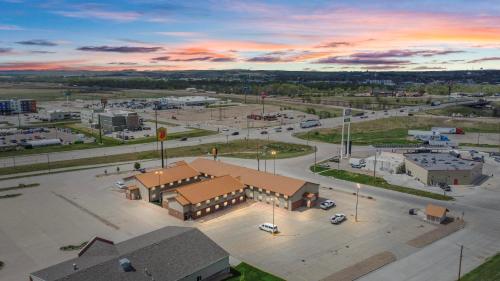 an aerial view of a building with a parking lot at Super 8 by Wyndham Ogallala in Ogallala