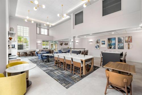 a dining room with tables and chairs at Homewood Suites by Hilton Slidell in Slidell