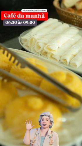 a figurine of a woman standing in front of some food at Hotel e Restaurante Santa Isabel in São Raimundo Nonato