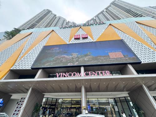 a view of a building with a sign on it at Dcapitale - Feria Homes in Hanoi