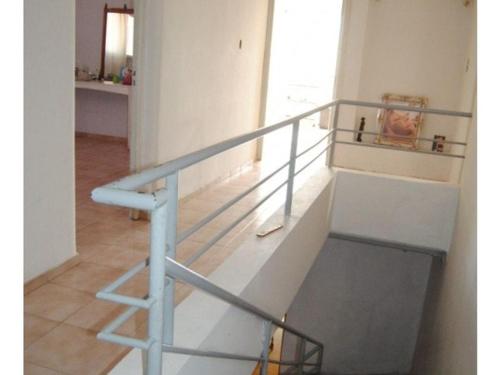 a stairway with a railing in a room at Casa quinta caminos del vino in San Rafael
