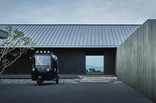 a black van parked outside of a building at TAYUTA amakusa in Kami Amakusa
