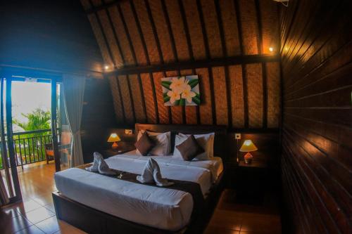 Katil atau katil-katil dalam bilik di Bataran Garden Cottage