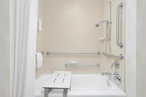 a bathroom with a sink and a bench in it at Hampton Inn & Suites Chattanooga/Hamilton Place in Chattanooga