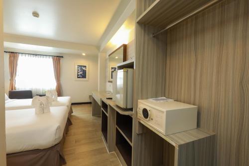 Flipper House Hotel - SHA Extra Plusにあるベッド