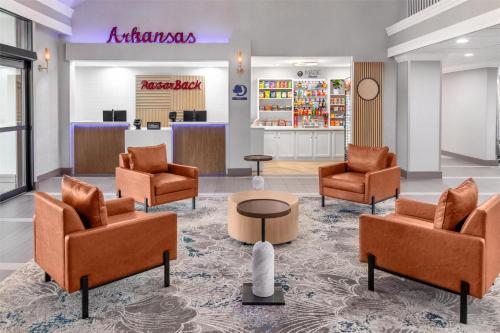 a lobby with chairs and a waiting room at DoubleTree by Hilton Springdale in Springdale