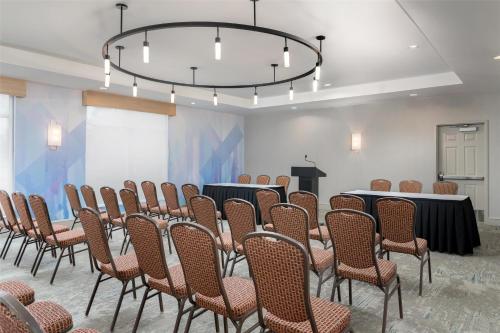 a room with a bunch of chairs and a podium at Hilton Garden Inn Dover in Dover