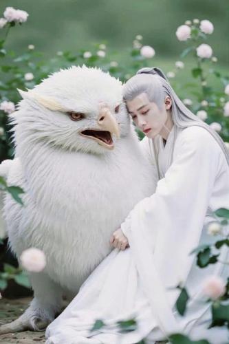 a woman is sitting next to a large bird with its face on at Onsen mineral bath, Vuon Vua, Thanh Thuy, Phu Tho in Phú Thọ