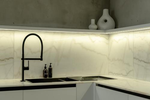 a kitchen with a sink and a counter top at Predmet Babakan Canggu Bali in Dalung
