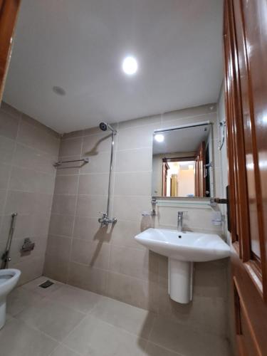 a bathroom with a sink and a toilet at The Guest House Islamabad G-13 in Islamabad